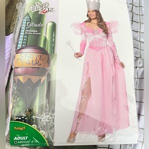 The Wizard of Oz - Glinda dress & crown in size medium from Spirit Halloween